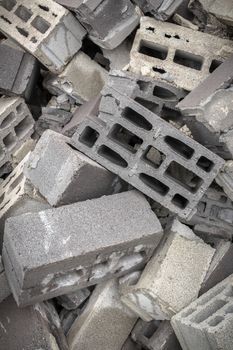 A mountain of concrete bricks arranged in bulk.
