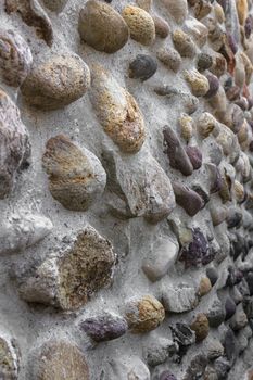 Front view of a wall of stones with cut irregular.