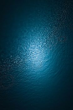 Designs and shapes on the water surface of a pool.