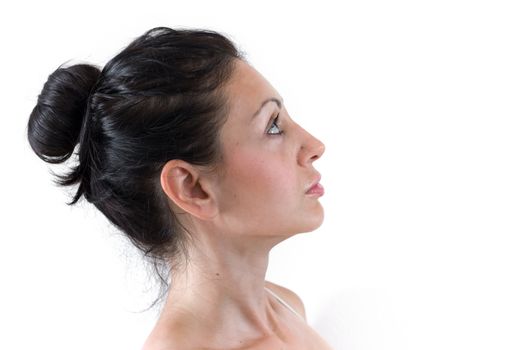 Close up of the face of a young woman with light skin and natural tones.