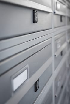 Modern Gray Mailboxes. They can be used for background and concepts. Shallow depth of field.