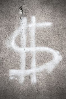 Dollar sign with cracks on wall. Financial crisis concept.