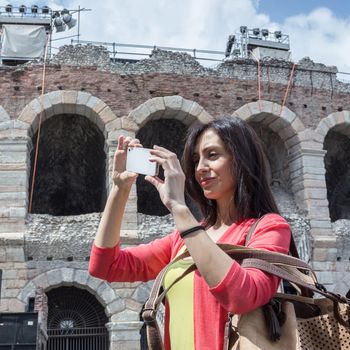 Tourist taking travel picture with phone. Urban style.