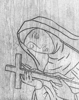 Engraving of the Virgin Mary holding in her hands the crucifix with Jesus Christ. Ideal for easter or other concept.