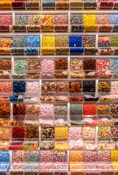 Candy display on a market. Various sweets for self-service.