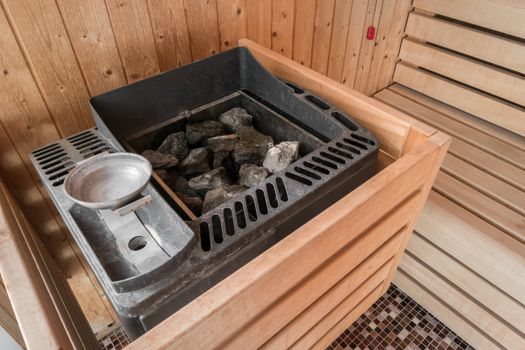 Sauna electric heater with stones in a SPA. Concept of relaxation and healthy lifestyle.