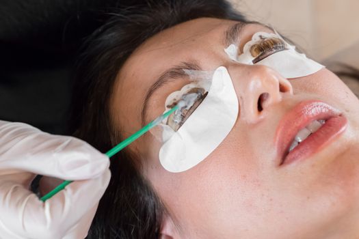 Cosmetic procedure of dyeing and lamination of eyelashes. Extension, perm, lamination of eyelashes. Eyelash care.