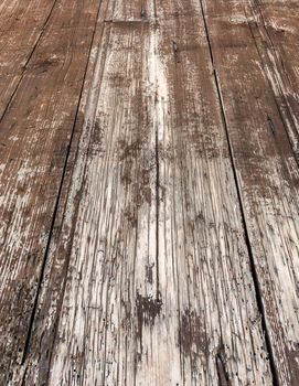 Close - up of an old wooden floor with rustic planks