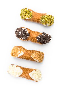 Traditional sicilian cannoli on white background - top view.