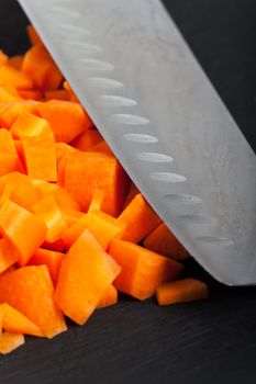 cut carrots and a blade