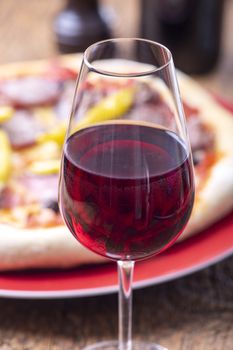 red wine and a fresh pizza