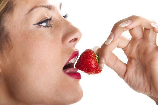 woman eating a strawberry
