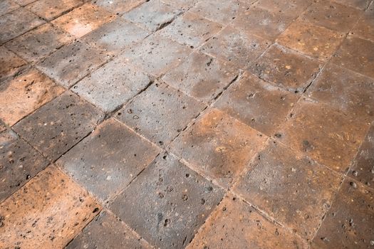 Stones slabs red colored cobblestones. Floor in ancient building. Ideal for textures and backgrounds.