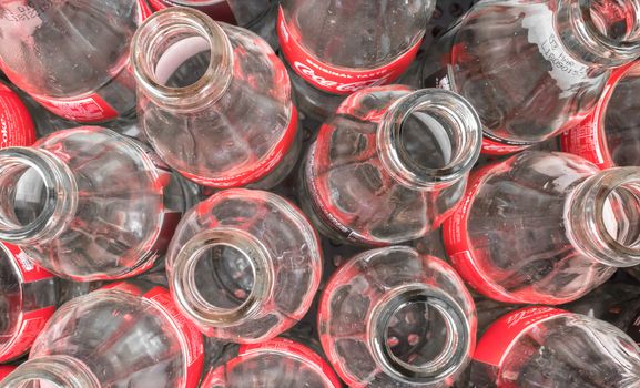 Empty glass bottles of Coca Cola, close-up. View from above. Italy February 19 2019.