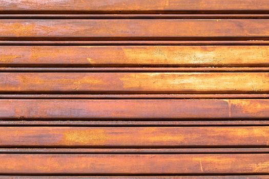 Rusty metal shutter gate. Grungy background texture.