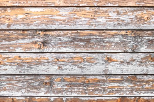 Rustic wooden background, scratched and damaged by time