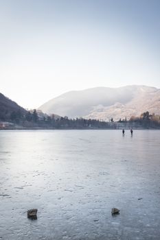 People skating on the Endine frozen lake. Endine Gaiano (BG) ITALY - January 22, 2019.