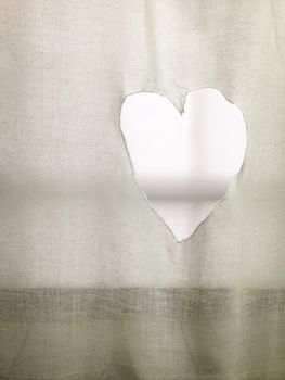 Heart Shaped Hole on a curtain. Ideal for concepts as valentines day or love symbol.
