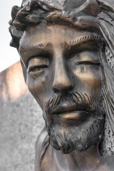 Bas-relief of Jesus crowned with thorns. High relief face of Jesus Christ with crown of thorns.