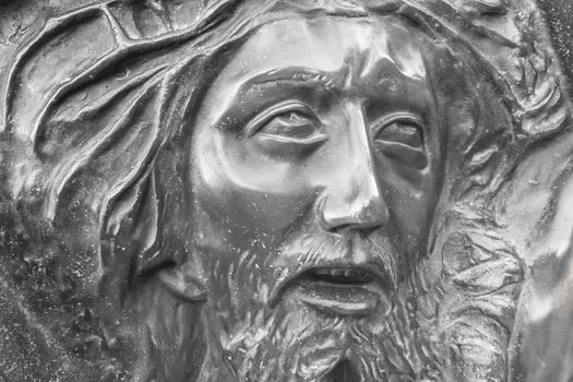 Bas-relief of Jesus crowned with thorns. High relief face of Jesus Christ with crown of thorns.