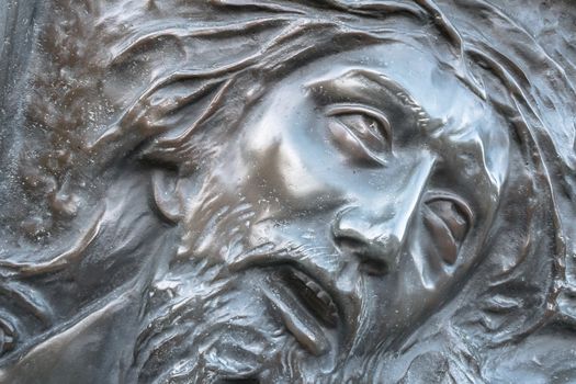 Bas-relief of Jesus crowned with thorns. High relief face of Jesus Christ with crown of thorns.