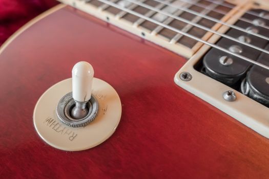 Rhythm and Treble mode pickup selector switch. Close - up of pickup selector switch on a vintage electric guitar.