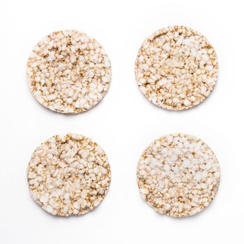 Four rice crackers isolated on white background. Concept of healthy eating and diet.