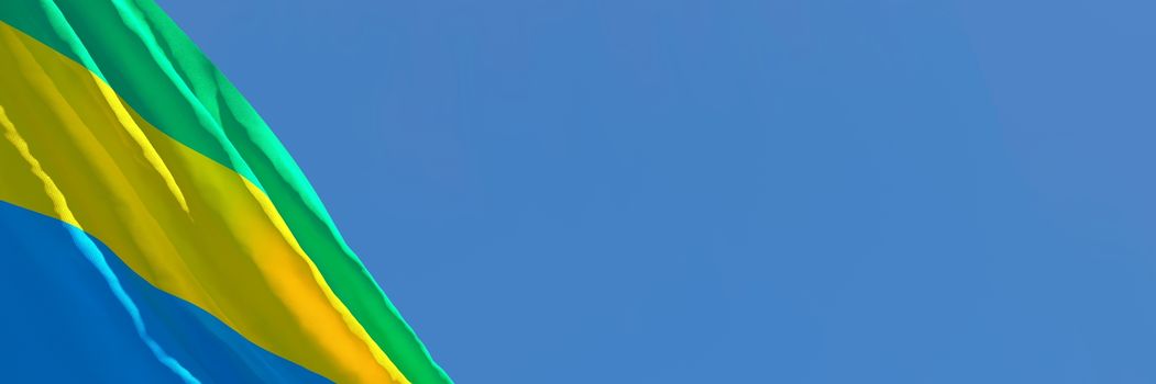 3D rendering of the national flag of Gabon waving in the wind against a blue sky.