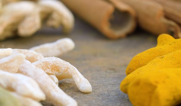 Macro shot spices on the table. Cardamom, turmeric, cinnamon. Extreme close up