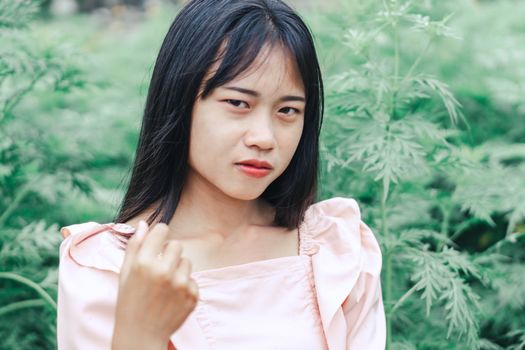 Portrait of asian happy woman smillng with nature garden, Selective focus