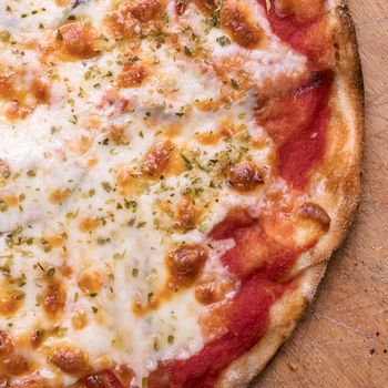 Italian Pizza Margherita with tomatoes and mozzarella. The best pizza in the world from Naples. Flat lay.