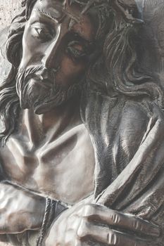 Vintage photo style. Fragment of Jesus Christ statue as a symbol of love, faith and religion.