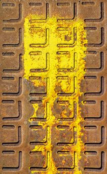 Rusty manhole cover. Relief pattern of rusty manhole cover in closeup with rust stain.