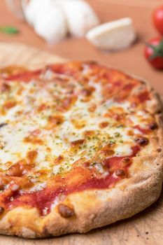 Italian Pizza Margherita with tomatoes and mozzarella. The best pizza in the world from Naples.