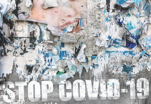 Message "Stop COVID-19" on old torn posters. COVID-19 outbreak. Lockdown. Concept of stop working activities due to coronavirus medical emergency.