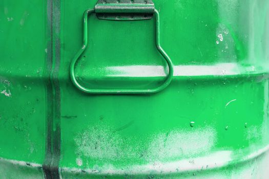 Green color can. Metal can with green paint drips.