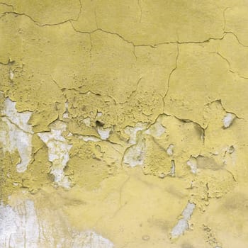 Peeled yellow wall. Ideal for textures or backgrounds.