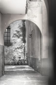 Vintage bicycle leaning against a wall. Retro style photo.