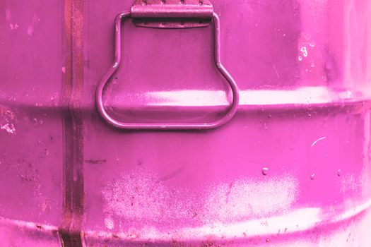 Pink color can. Metal can with pink paint drips.