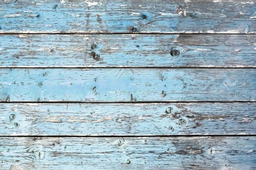 Light blue wood texture with horizontal planks. Ideal for backgrounds.