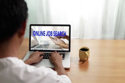 Business and job concept. Man use laptop computer online website find new career. Man searching vacancies or position on the internet. Man unemployed search finding jobs from internet. with copy space.