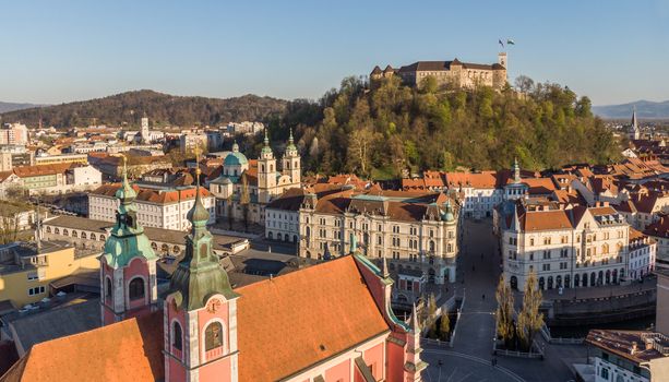 Aerial drone panoramic view of Ljubljana, capital of Slovenia in warm afternoon sun.