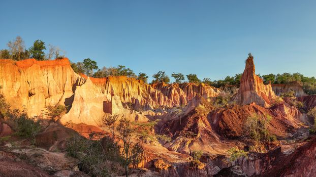 Marafa Depression (Hell's Kitchen canyon) with red cliffs and rocks in afteroon sunset light. Malindi, Kenya