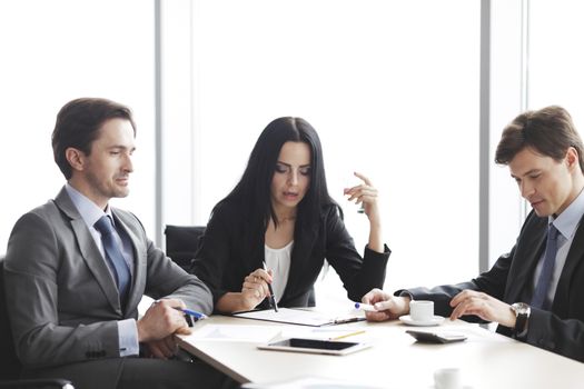 Business people discussing financial reports during a meeting