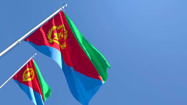 3D rendering of the national flag of Eritrea waving in the wind against a blue sky