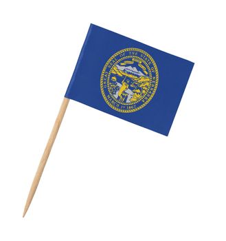 Small paper US-state flag on wooden stick - Nebraska - Isolated on white