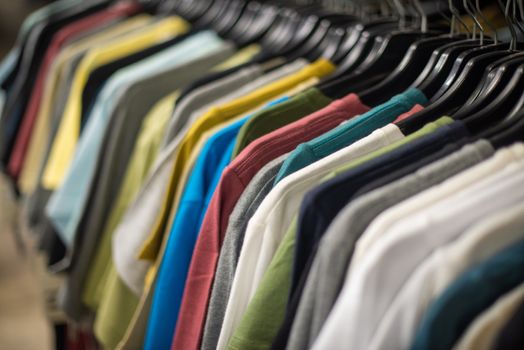 Selective focus of t shirts on rack