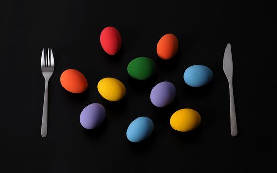 Multi-colorful of easter eggs on background in studio with close-up shot which include many colour such as yellow, green, blue, purple, red covered on eggs by art painting