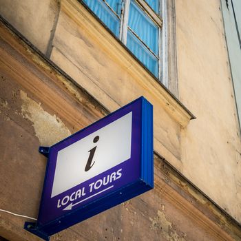 Local tours sign in Krakow, Poland, Europe. Old medieval  town of Cracow listed as unesco heritage site.