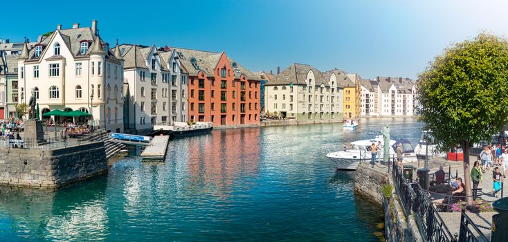 Alesund, Norway - 26 July, 2013: view of central city part with historic art nouveau architectural style in which most of the town was rebuilt after a fire in 1904. Popular tourist destination in Scandinavia, Europe.